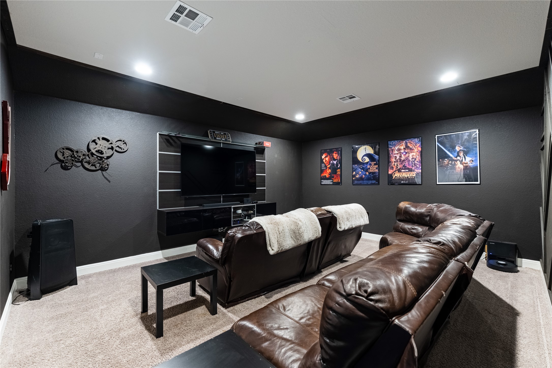 20524 Fairleaf Street Pflugerville, TX 78660 - Photo 28 of 35 Home theater room with light carpet and a textured wall