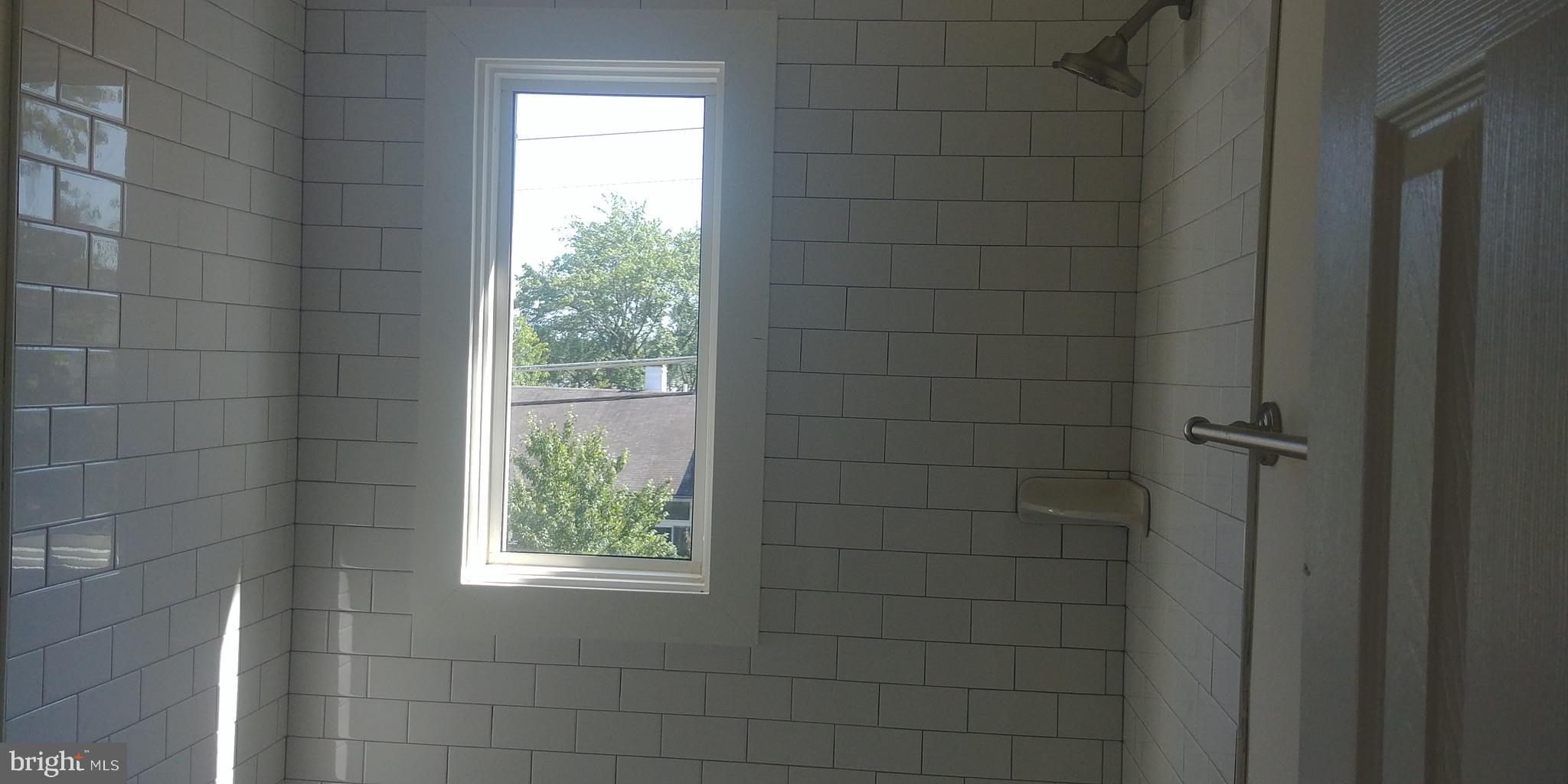 7404 Greeley Road Hyattsville, MD 20785 - Photo 13 of 23 New bath with windows upstairs