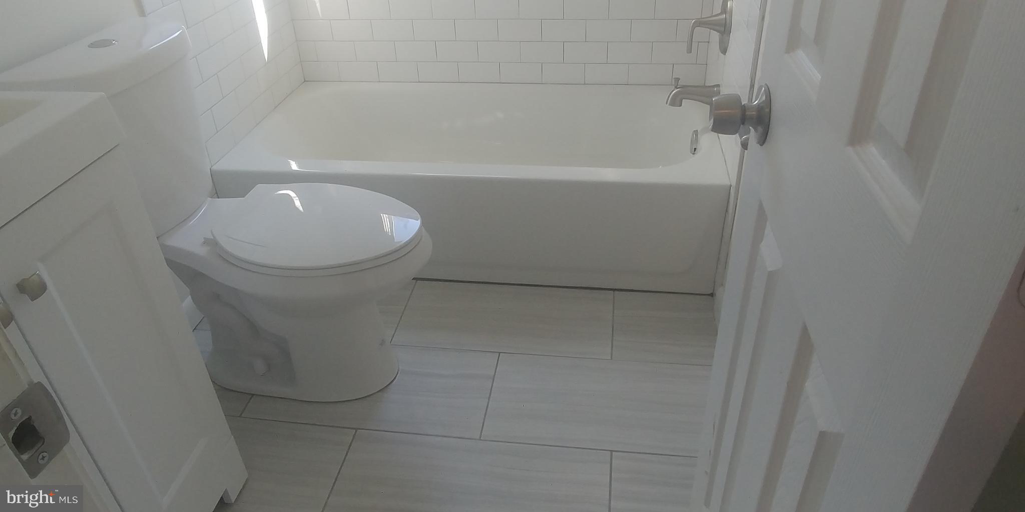 7404 Greeley Road Hyattsville, MD 20785 - Photo 16 of 23 Hard tile floor in the bathroom