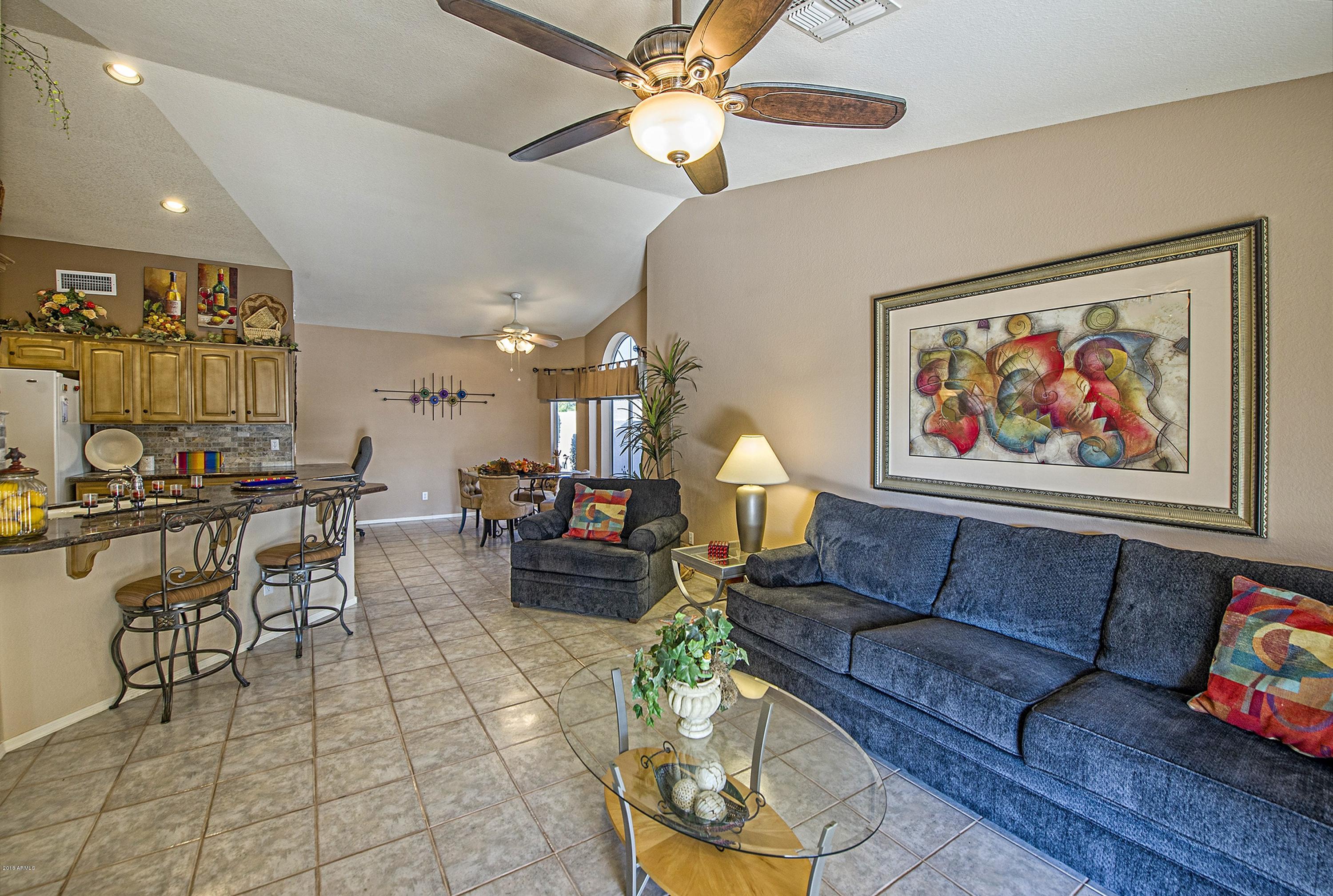 15791 Piccadilly Road Goodyear, AZ 85395 - Photo 7 of 19 007_Family Room Open to Kitchen