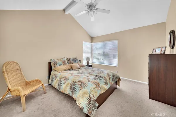 a bedroom with a bed chair and window