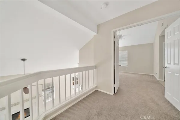 a view of a hallway with windows