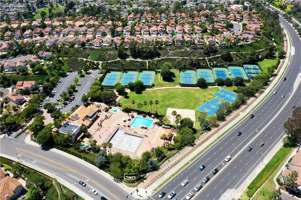 an aerial view of residential houses with city view