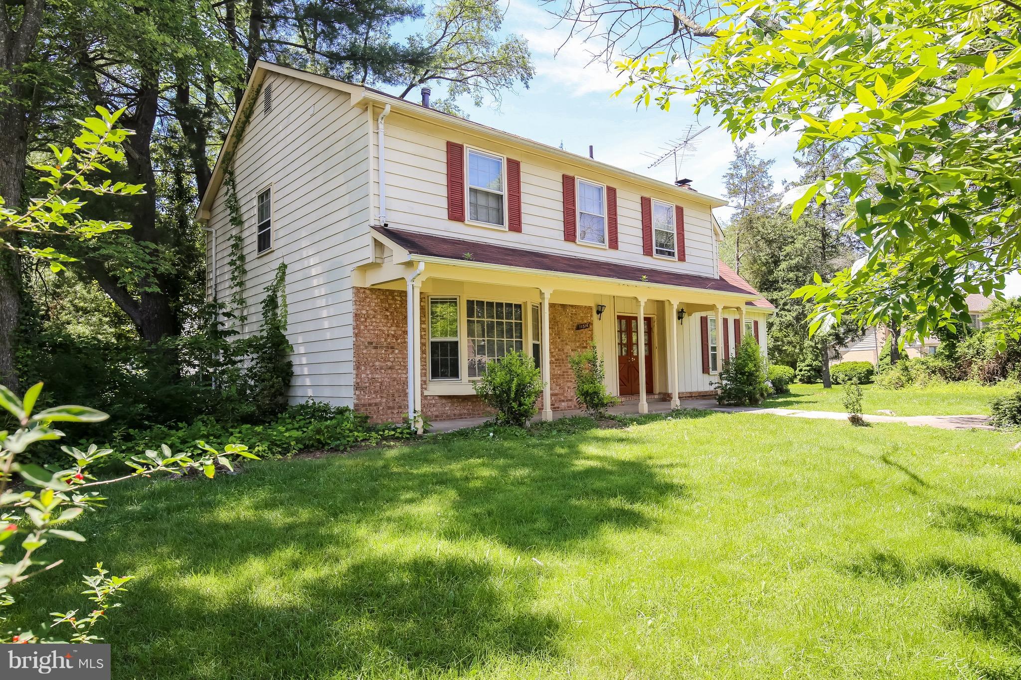 11514 Seven Locks Road Rockville, MD 20854 - Photo 4 of 10 a front view of a house with a yard
