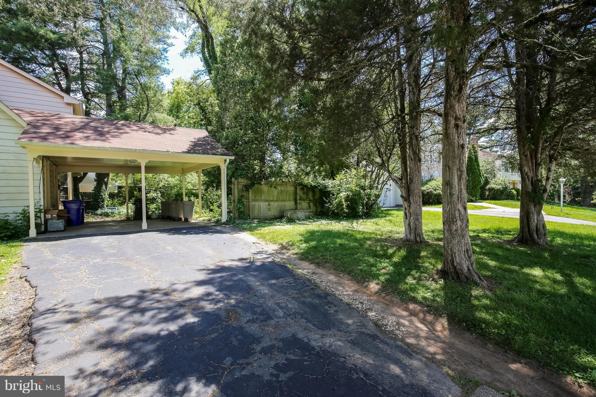 11514 Seven Locks Road Rockville, MD 20854 - Photo 10 of 10 a view of a patio with a table and chairs under an umbrella