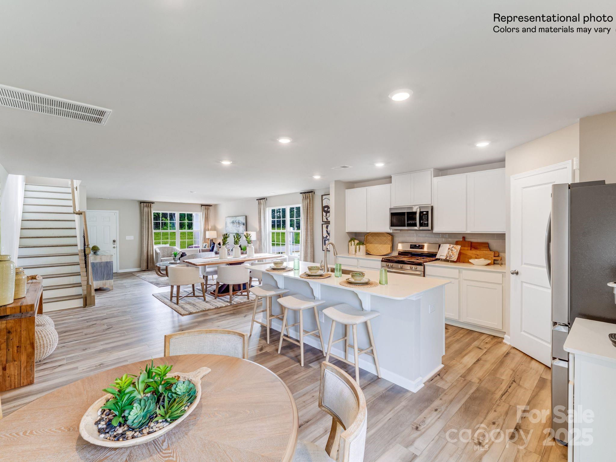 1611 Spring Edgemoor Sc 29712 Edgemoor, SC 29712 - Photo 15 of 32 a living room with stainless steel appliances furniture a rug and a kitchen view