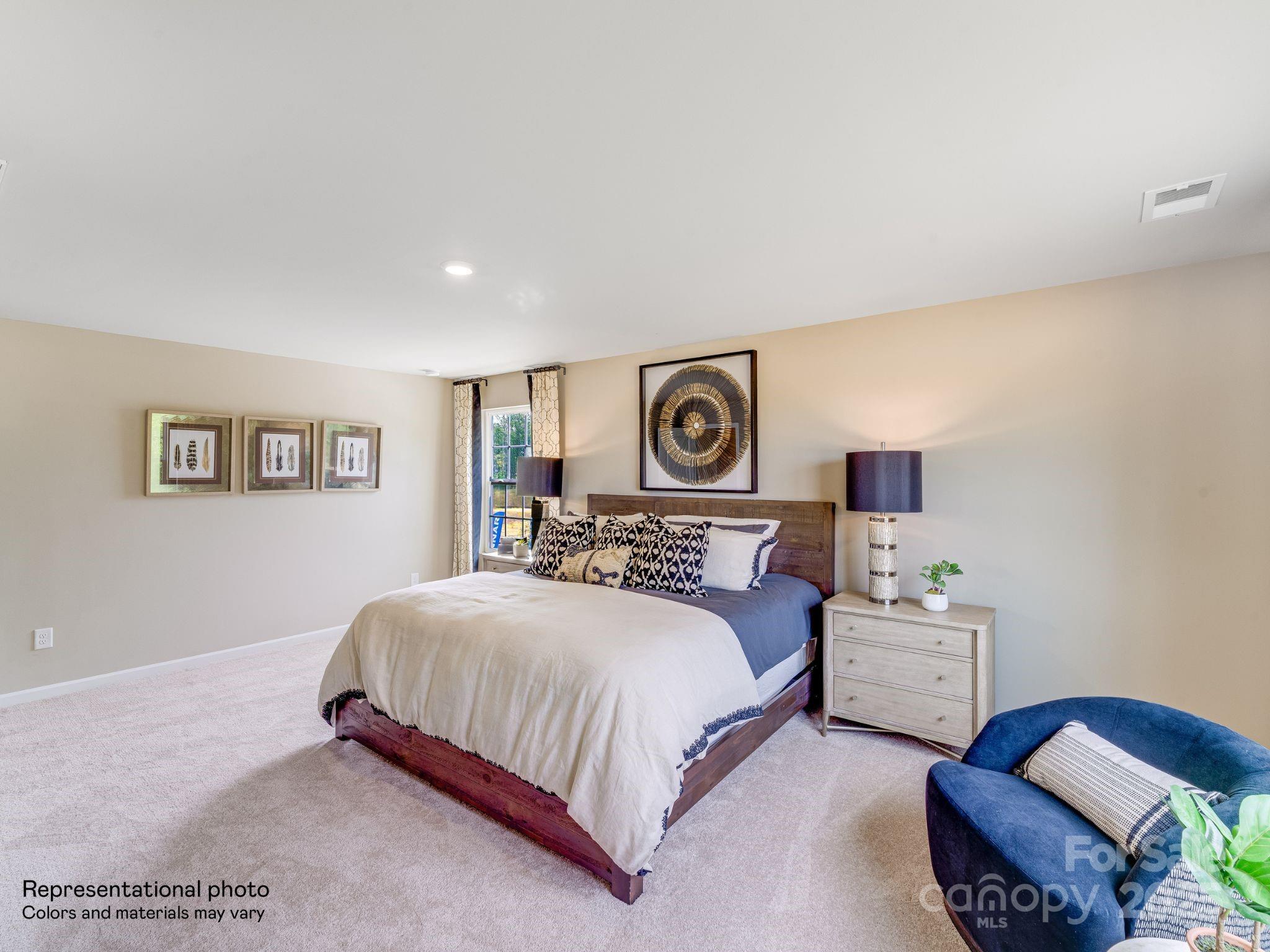 1611 Spring Edgemoor Sc 29712 Edgemoor, SC 29712 - Photo 23 of 32 a bedroom with a bed and a lamp on dresser