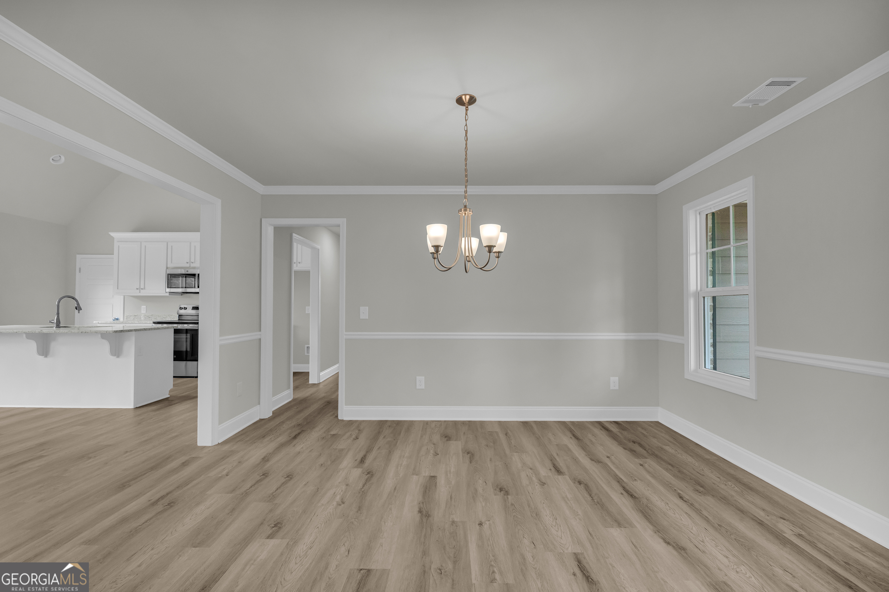 110 Sewell Road Lavonia, GA 30553 - Photo 11 of 73 a view of a room with wooden floors and ceiling fan