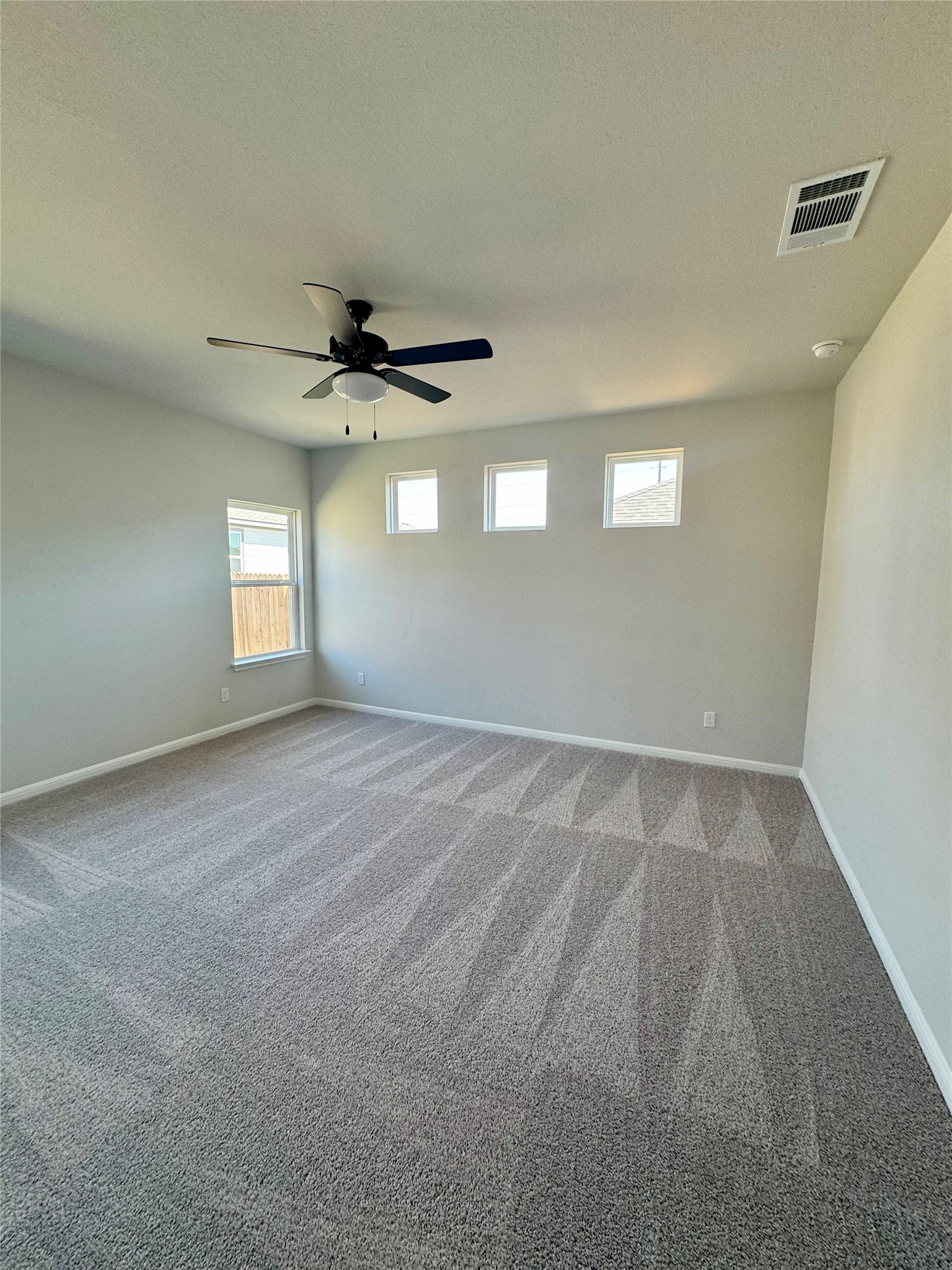 241 Alcatraz Loop Jarrell, TX 76537 - Photo 8 of 10 a view of a livingroom with a ceiling fan and window