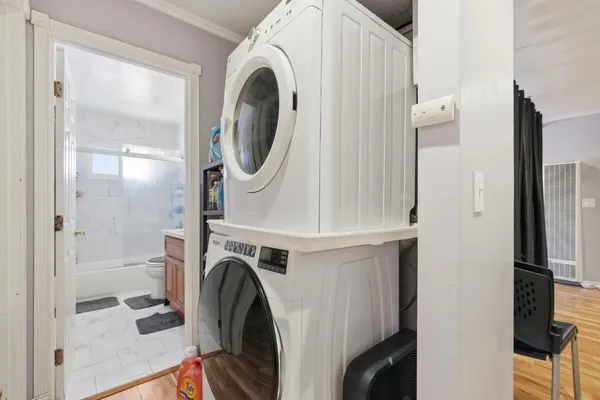 a view of a hallway with washer and dryer