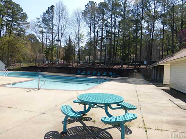 737 Benchmark Drive Raleigh, NC 27615 - Photo 14 of 14 a backyard of a house with table and chairs
