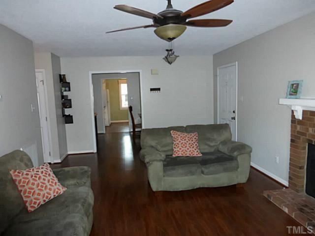 737 Benchmark Drive Raleigh, NC 27615 - Photo 6 of 14 a living room with furniture and a rug