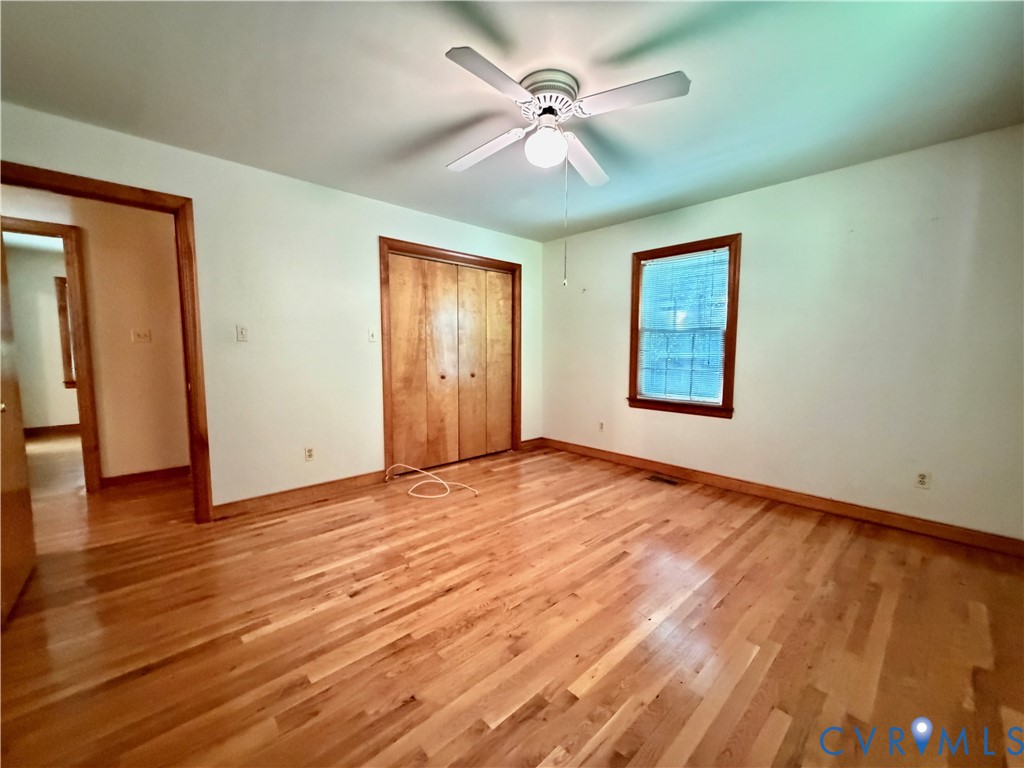3933 Dunraven Road North Chesterfield, VA 23236 - Photo 29 of 30 a view of an empty room with a window and wooden floor