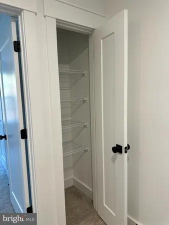a bathroom with a glass door shower