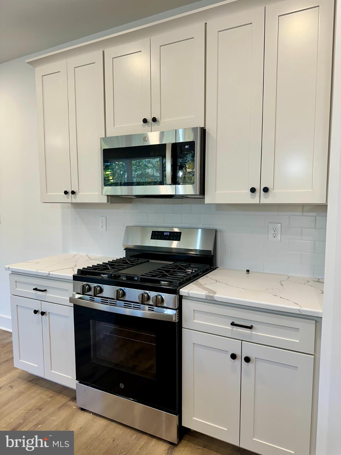 1024 Trinity Road York, PA 17408 - Photo 7 of 17 a kitchen with stainless steel appliances granite countertop grey cabinets and a stove a sink