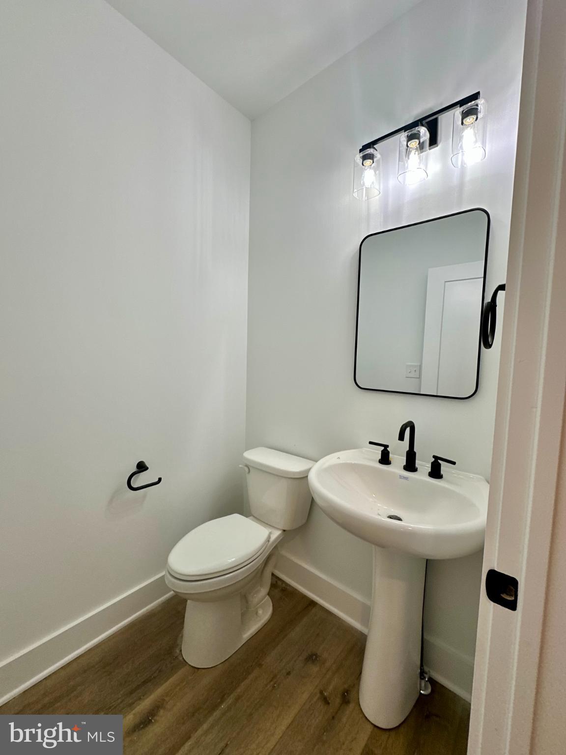 1024 Trinity Road York, PA 17408 - Photo 9 of 17 a bathroom with a toilet sink and mirror