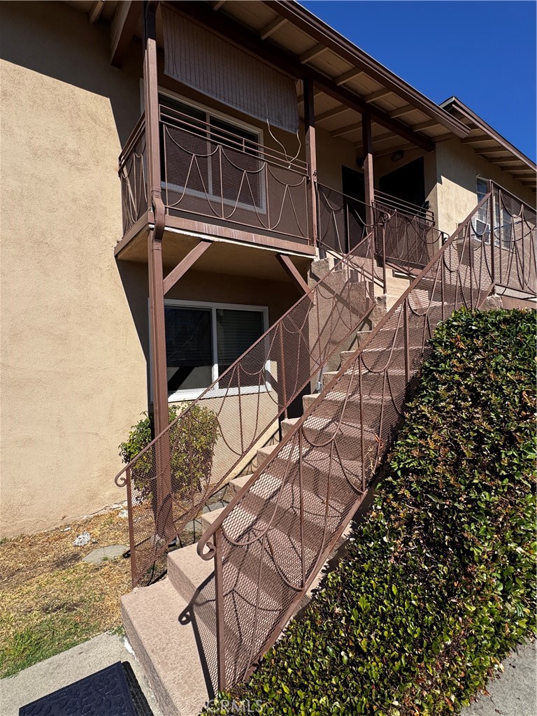 1357 Orange Grove Avenue, Unit A Glendale, CA 91205 - Photo 15 of 17 a house with trees in front of it