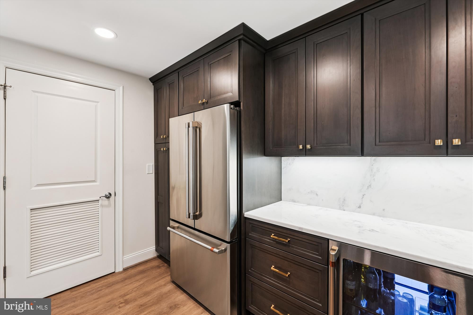 2501 Wisconsin Avenue Northwest, Unit 7 Washington, DC 20007 - Photo 19 of 30 Sleek modern kitchen with rich cabinetry.