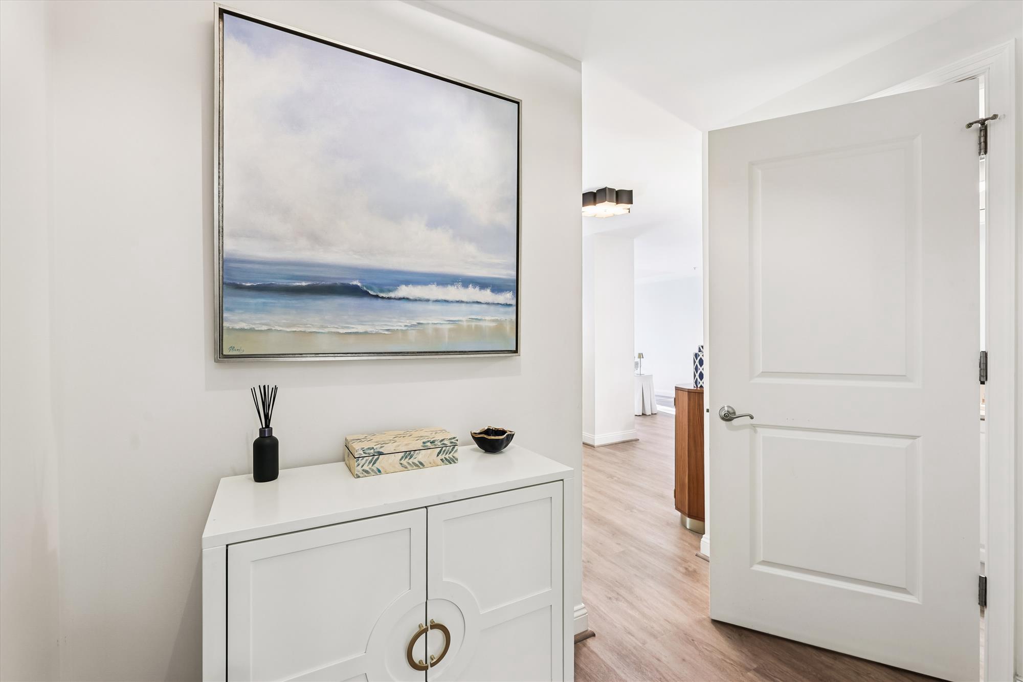 2501 Wisconsin Avenue Northwest, Unit 7 Washington, DC 20007 - Photo 22 of 28 a hallway with view of wooden floor and mirror