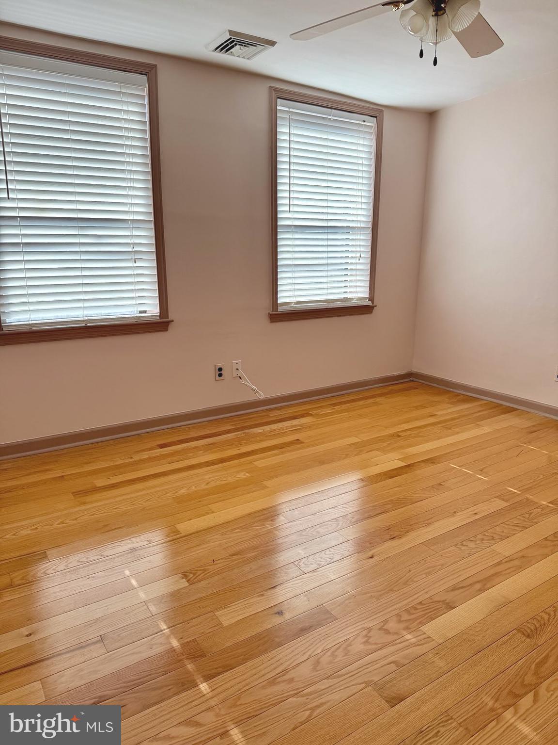 811 Earp Street Philadelphia, PA 19147 - Photo 18 of 29 a view of an empty room with window and wooden floor