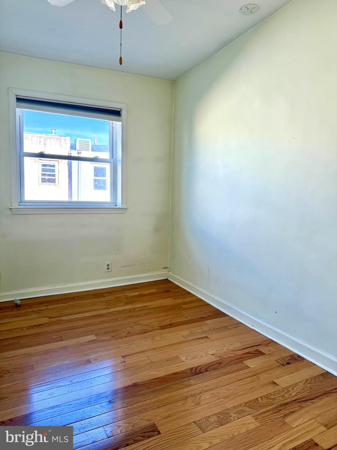 811 Earp Street Philadelphia, PA 19147 - Photo 19 of 29 an empty room with wooden floor and windows