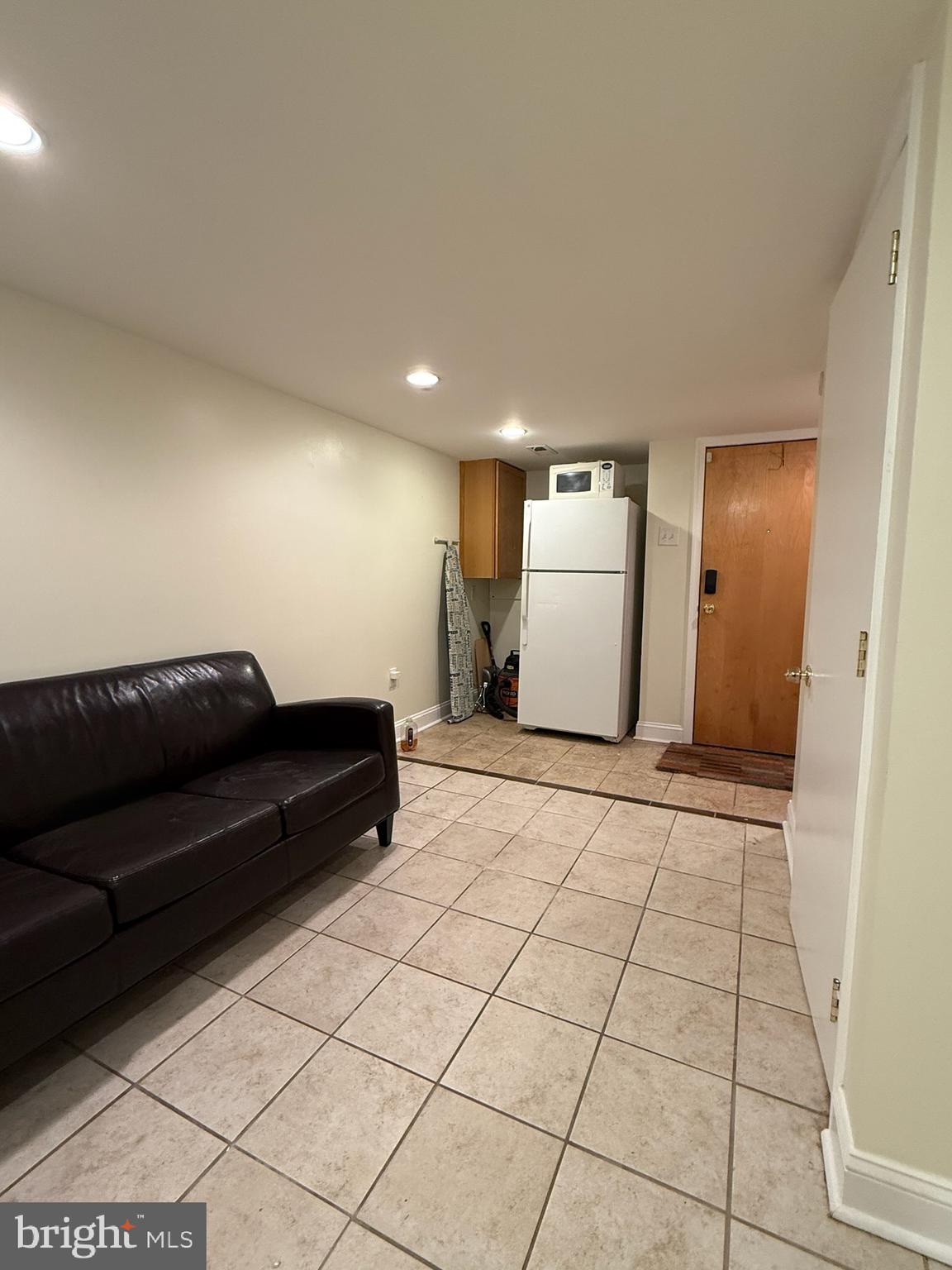 811 Earp Street Philadelphia, PA 19147 - Photo 23 of 29 a living room with a couch and a walk in closet