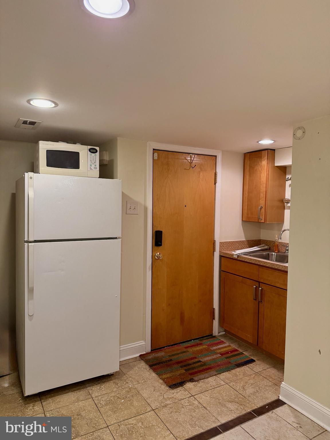 811 Earp Street Philadelphia, PA 19147 - Photo 25 of 29 a view of kitchen with stainless steel appliances granite countertop cabinets and a refrigerator