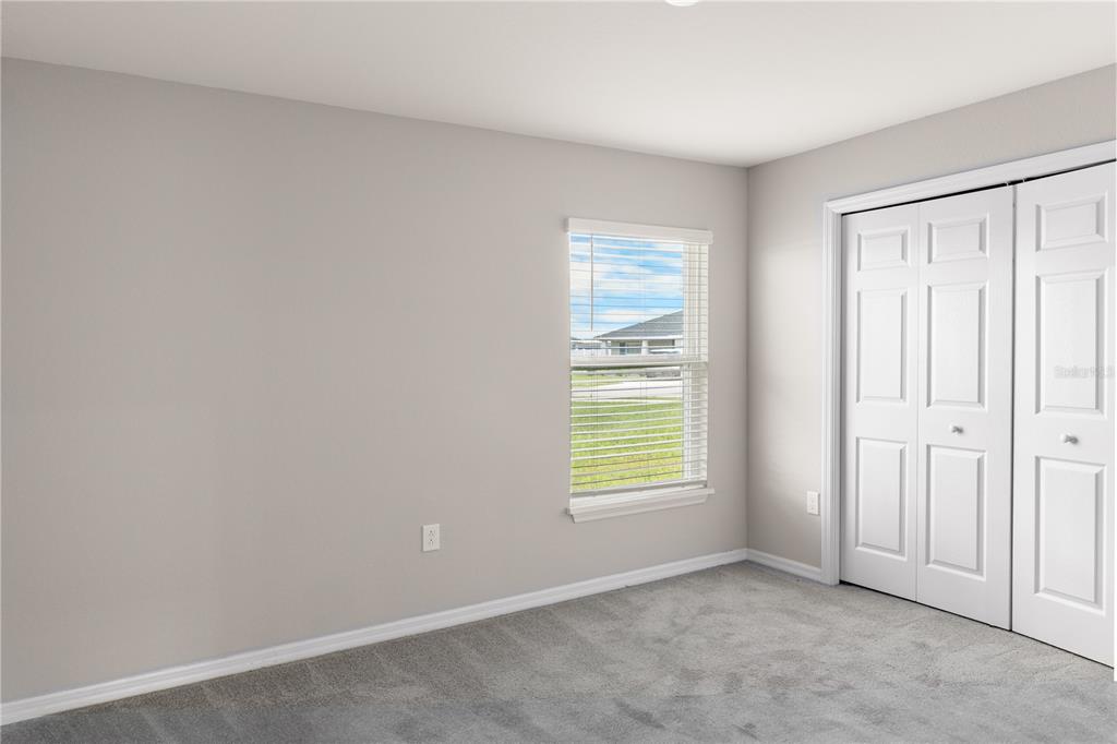 961 Inverness Way Lake Lake Alfred, FL 33850 - Photo 13 of 22 an empty room with windows