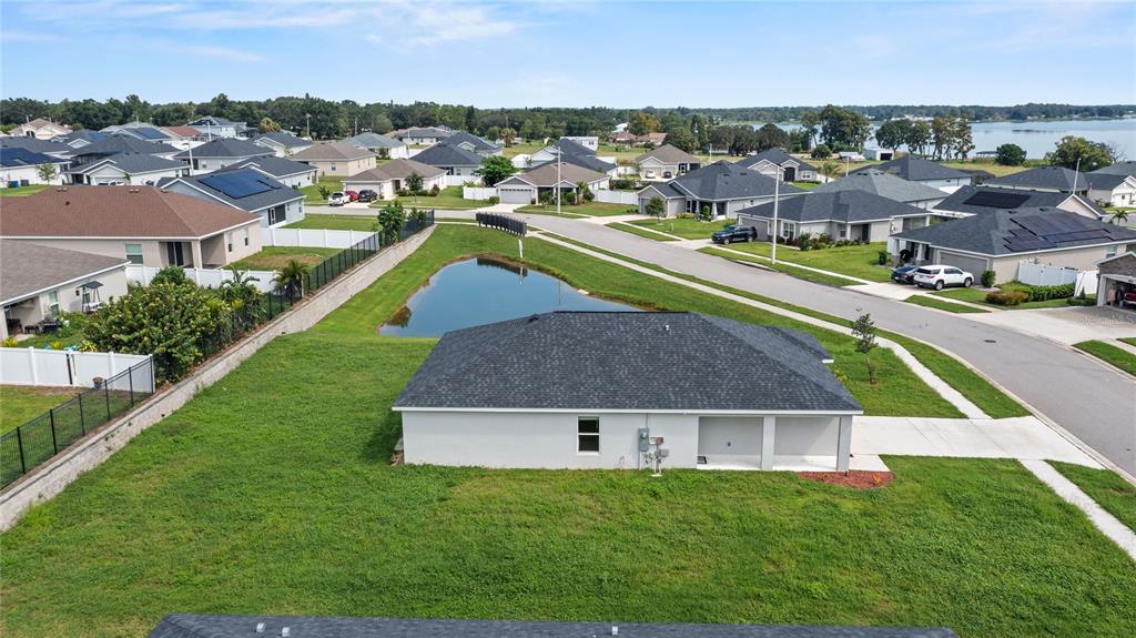 961 Inverness Way Lake Lake Alfred, FL 33850 - Photo 16 of 22 an aerial view of a house with a garden