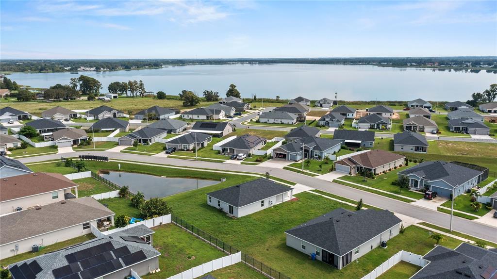 961 Inverness Way Lake Lake Alfred, FL 33850 - Photo 17 of 22 an aerial view of a house with a ocean view