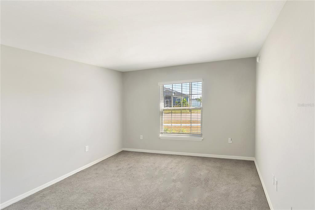 961 Inverness Way Lake Lake Alfred, FL 33850 - Photo 8 of 22 an empty room with a window