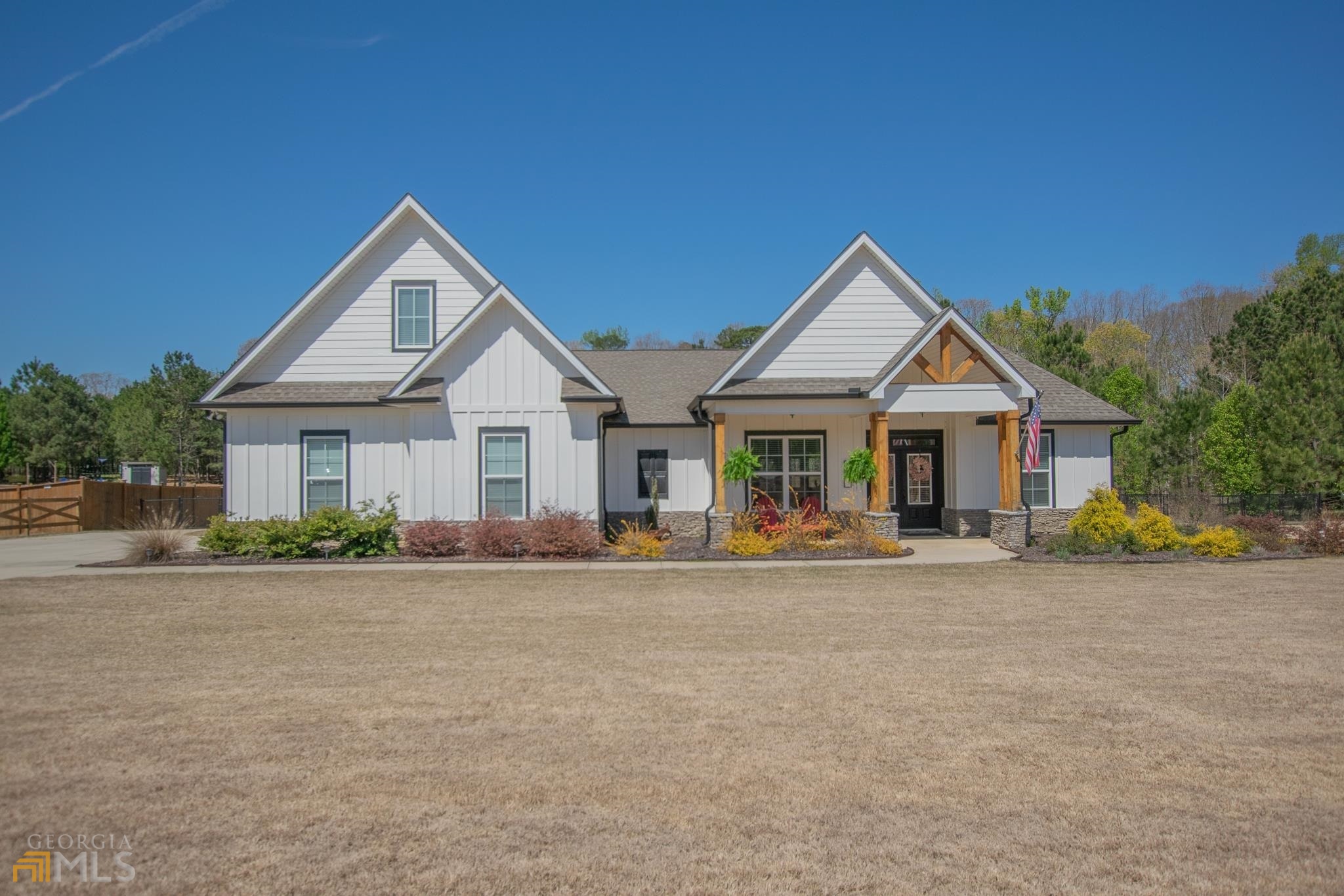 975 South Bethany Road Locust Grove, GA 30248 - Photo 1 of 1 a front view of a house with a yard and garage
