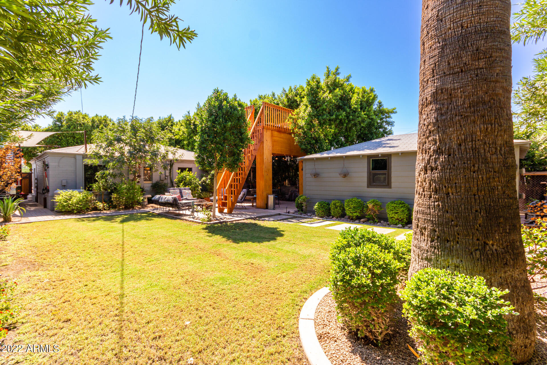 1206 East Almeria Road Phoenix, AZ 85006 - Photo 20 of 28 a view of a swimming pool with a house in the background