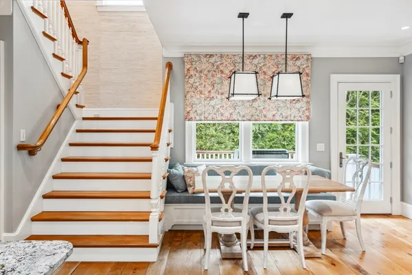 a view of a dining room with furniture stairs