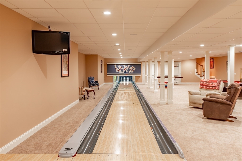 19 High Ridge Drive Mattapoisett, MA 02739 - Photo 27 of 30 a view of a living room and a flat screen tv