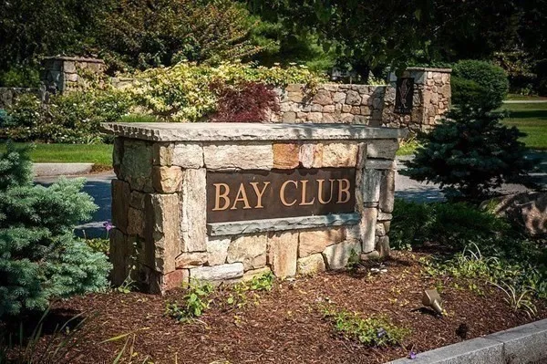 a sign that is on a brick wall