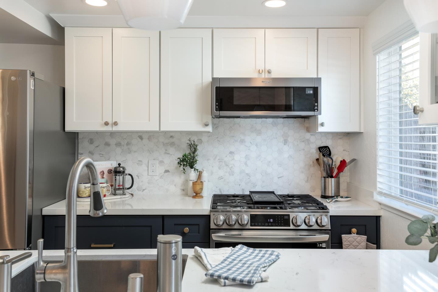 1394 North Loop Drive San Jose, CA 95126 - Photo 13 of 40 a kitchen with stainless steel appliances granite countertop a stove and a microwave