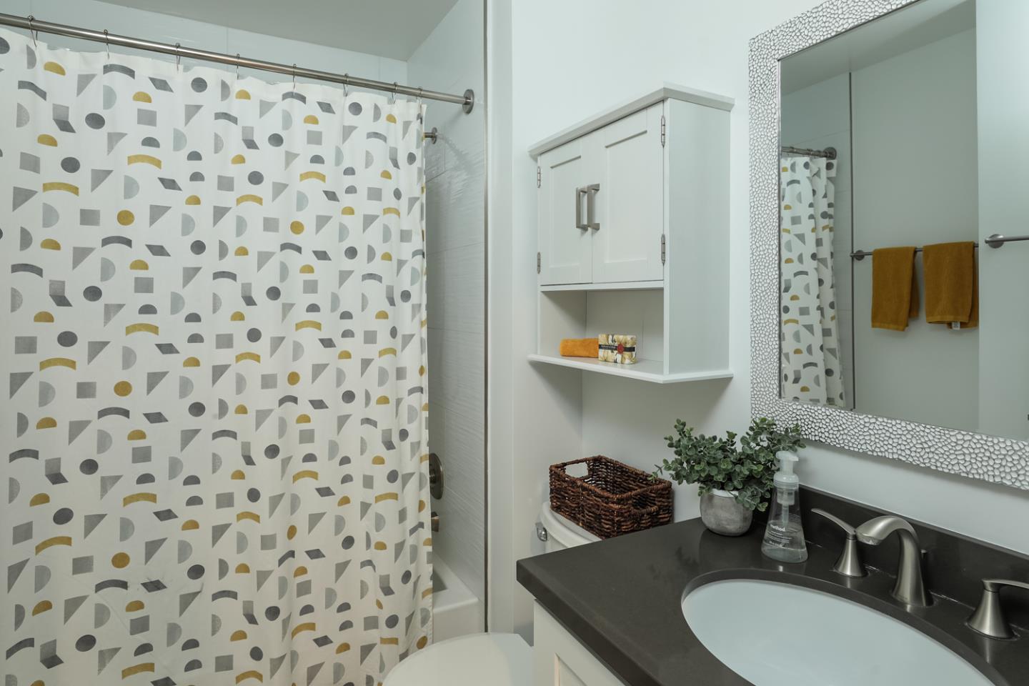 1394 North Loop Drive San Jose, CA 95126 - Photo 23 of 40 a bathroom with a sink toilet and a mirror