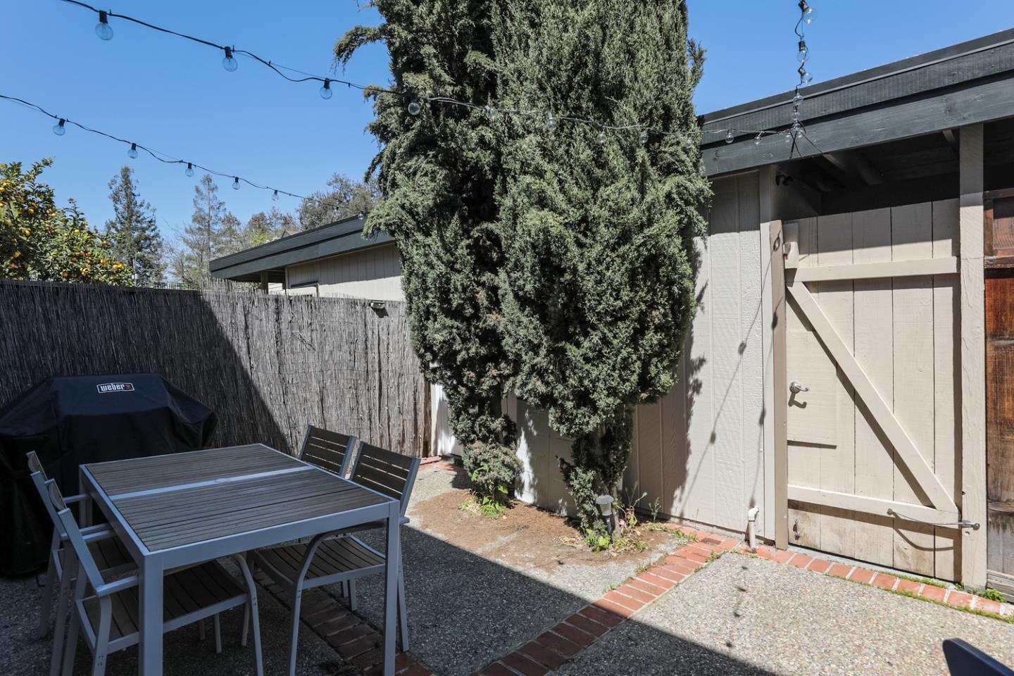 1394 North Loop Drive San Jose, CA 95126 - Photo 30 of 40 a backyard of a house with table and chairs