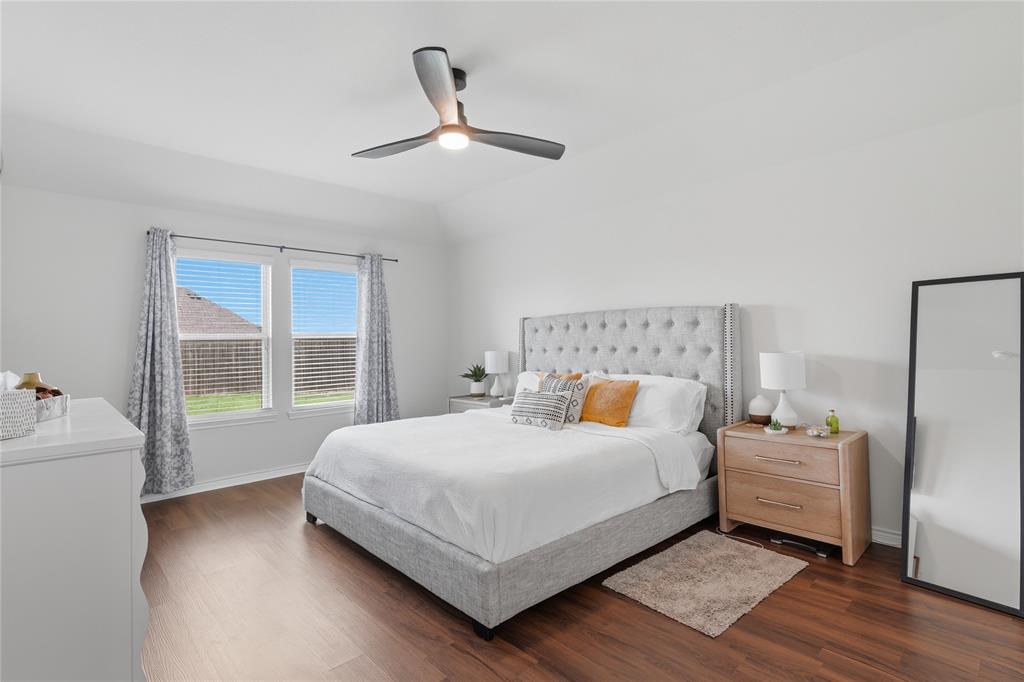 10101 Travis Road Little Elm, TX 75068 - Photo 19 of 26 a bedroom with a bed and window