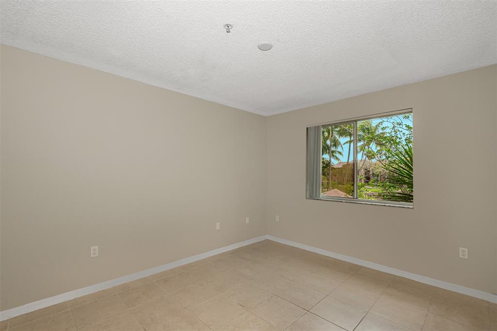 3848 Lyons Road, Unit 202 Coconut Creek, FL 33073 - Photo 17 of 32 an empty room with windows