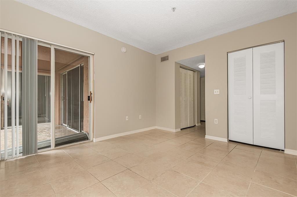 3848 Lyons Road, Unit 202 Coconut Creek, FL 33073 - Photo 18 of 32 a view of entryway with wooden floor