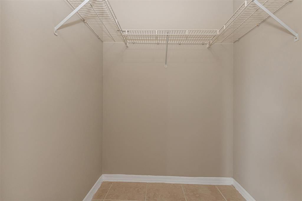 3848 Lyons Road, Unit 202 Coconut Creek, FL 33073 - Photo 19 of 32 a view of a room with racks on the wall