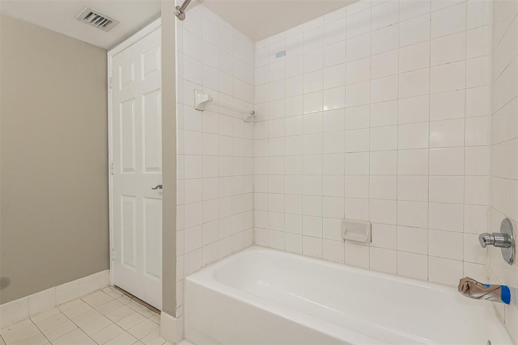3848 Lyons Road, Unit 202 Coconut Creek, FL 33073 - Photo 21 of 32 a bathroom with a bathtub
