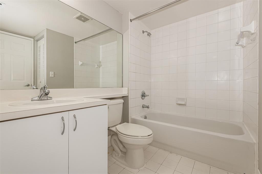 3848 Lyons Road, Unit 202 Coconut Creek, FL 33073 - Photo 26 of 32 a bathroom with a granite countertop sink a toilet and shower