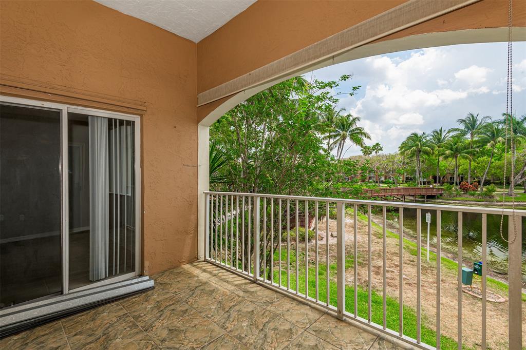3848 Lyons Road, Unit 202 Coconut Creek, FL 33073 - Photo 27 of 32 a view of a balcony with lake view