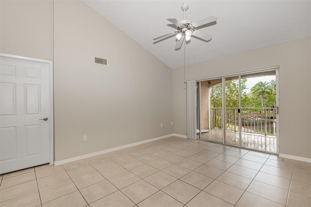3848 Lyons Road, Unit 202 Coconut Creek, FL 33073 - Photo 5 of 32 a view of an empty room with a window