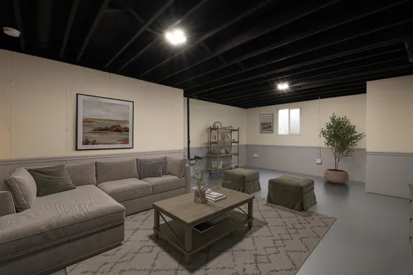 a living room with furniture and a chandelier