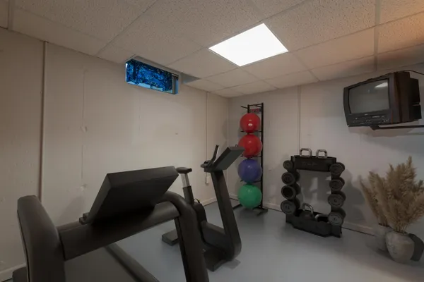 a room with furniture and a flat screen tv