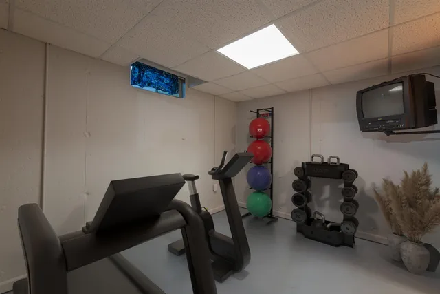 a room with furniture and a flat screen tv
